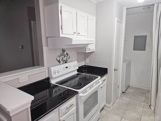 2201 Scenic Hwy Unit E-7, Pensacola, FL 32503 - kitchen featuring electric range, white cabinetry, separate washer and dryer, tasteful backsplash, and under cabinet range hood