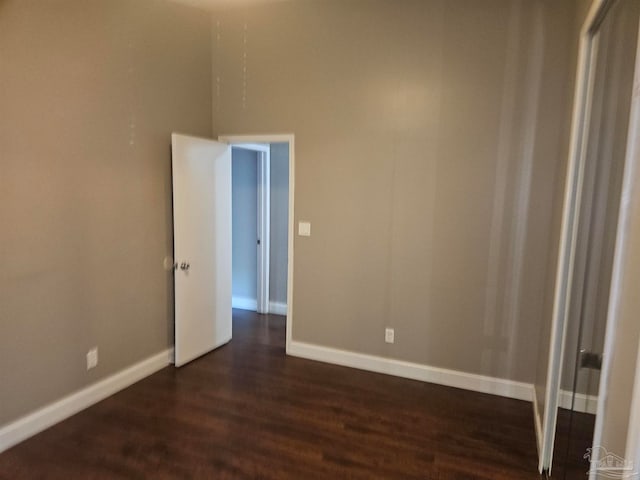 2201 Scenic Hwy Unit E-7, Pensacola, FL 32503 - spare room with dark wood finished floors and baseboards