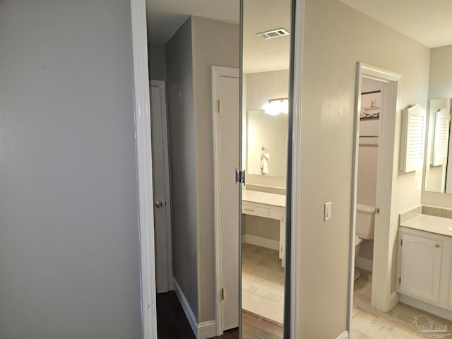 2201 Scenic Hwy Unit E-7, Pensacola, FL 32503 - bathroom with vanity, toilet, and marble look tile flooring