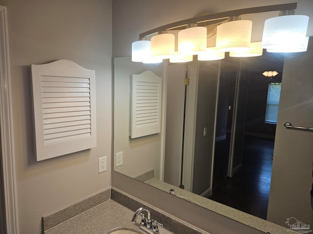 2201 Scenic Hwy Unit E-7, Pensacola, FL 32503 - bathroom featuring a sink and baseboards