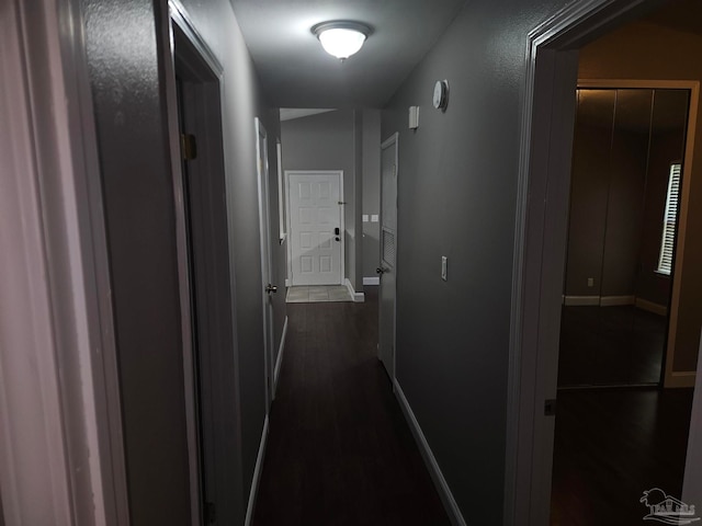2201 Scenic Hwy Unit E-7, Pensacola, FL 32503 - hallway with baseboards and dark wood-type flooring