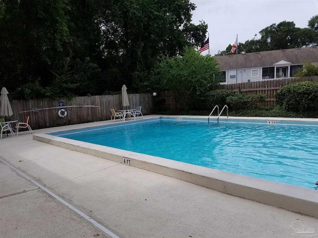 2201 Scenic Hwy Unit E-7, Pensacola, FL 32503 - community pool featuring a fenced backyard and a patio area