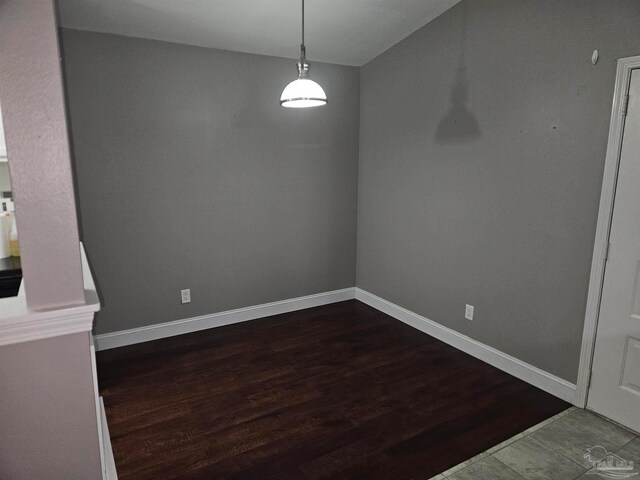 2201 Scenic Hwy Unit E-7, Pensacola, FL 32503 - unfurnished dining area with dark wood finished floors and baseboards