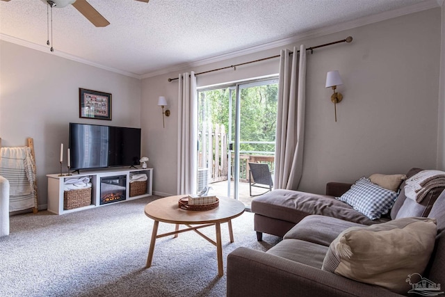 1314 Foxborough Dr, Pensacola, FL 32514 - carpeted living room featuring a textured ceiling, a glass covered fireplace, baseboards, a ceiling fan, and ornamental molding