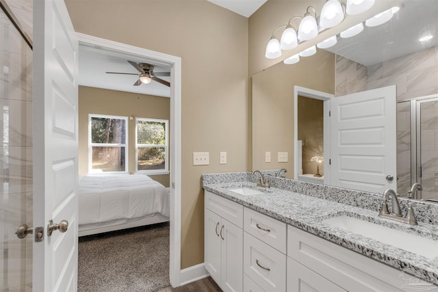 bathroom featuring ceiling fan, vanity, and a shower with shower door