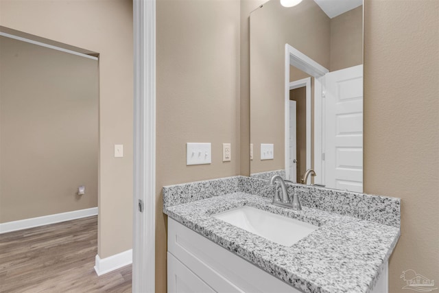 bathroom with vanity and wood-type flooring