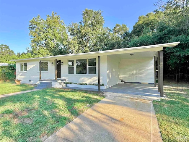 single story home with a front lawn and a carport