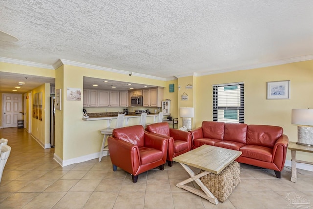 living area featuring a textured ceiling, light tile patterned flooring, baseboards, and ornamental molding