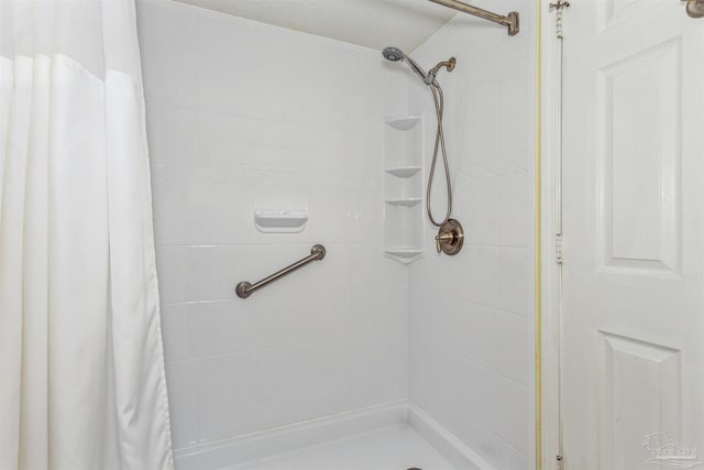 bathroom with a stall shower