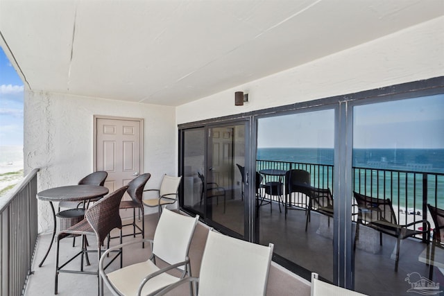 balcony featuring a water view