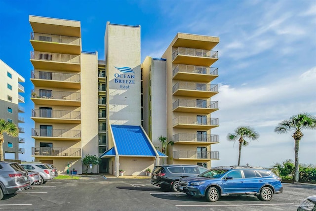 view of property with uncovered parking