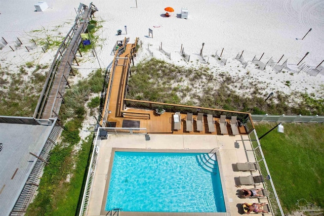 view of pool featuring fence