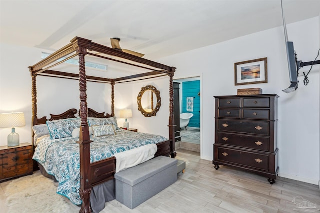 bedroom featuring connected bathroom, ceiling fan, and light hardwood / wood-style floors