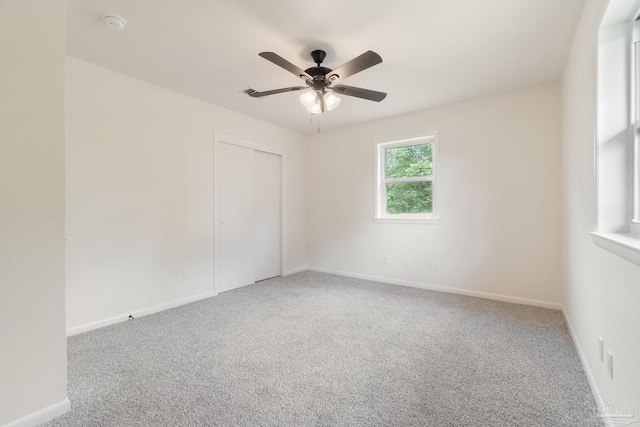 2663 E Kingsfield Rd, Pensacola, FL 32534 - carpeted spare room with baseboards and ceiling fan