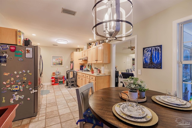 dining room with visible vents, baseboards, a notable chandelier, stone finish floor, and recessed lighting