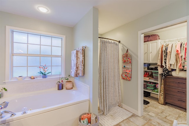 full bath with a garden tub and a shower with shower curtain