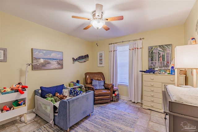 bedroom with ceiling fan and baseboards
