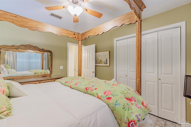 bedroom featuring ceiling fan, visible vents, and light tile patterned floors