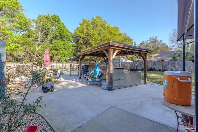 view of patio with a gazebo and a fenced backyard