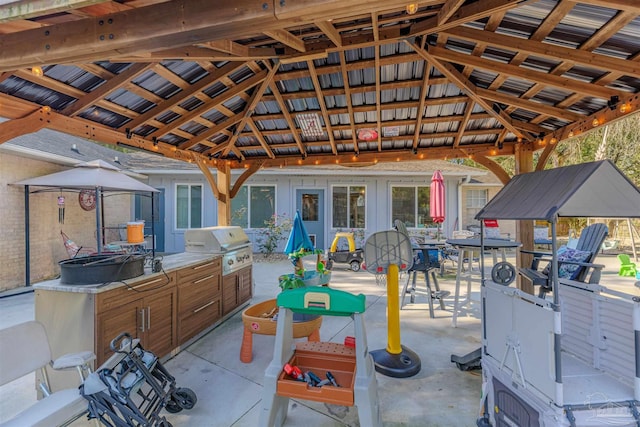 view of patio / terrace featuring a gazebo, outdoor dining area, and area for grilling