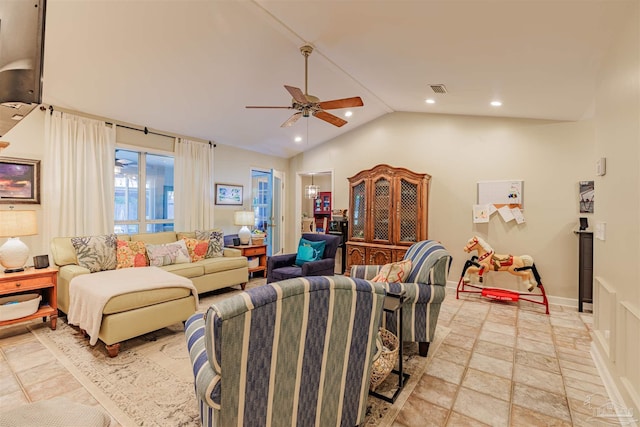 living area featuring stone tile flooring, ceiling fan, recessed lighting, and lofted ceiling