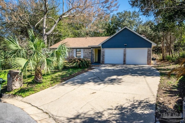 view of front of property featuring a garage, concrete driveway, and brick siding