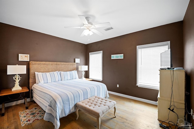 446 Harbor Light Cir, Gulf Shores, AL 36542 - bedroom with light wood-style flooring, baseboards, and ceiling fan