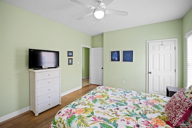 446 Harbor Light Cir, Gulf Shores, AL 36542 - bedroom with wood finished floors, baseboards, and a ceiling fan