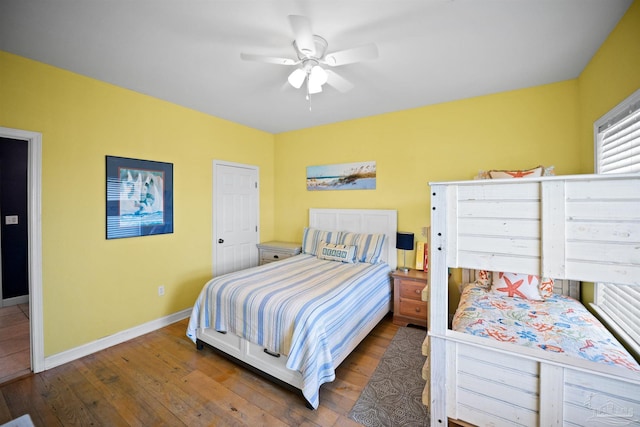 446 Harbor Light Cir, Gulf Shores, AL 36542 - bedroom featuring hardwood / wood-style flooring, baseboards, and ceiling fan