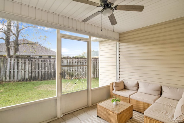 sunroom / solarium with a wealth of natural light, ceiling fan, and wood ceiling