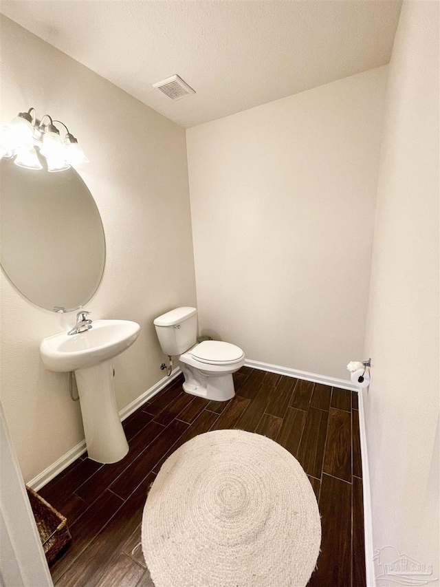 bathroom featuring toilet