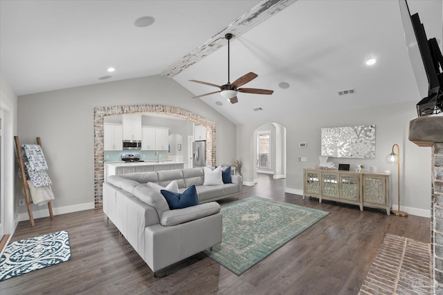 living room featuring sink, vaulted ceiling, dark hardwood / wood-style floors, and ceiling fan