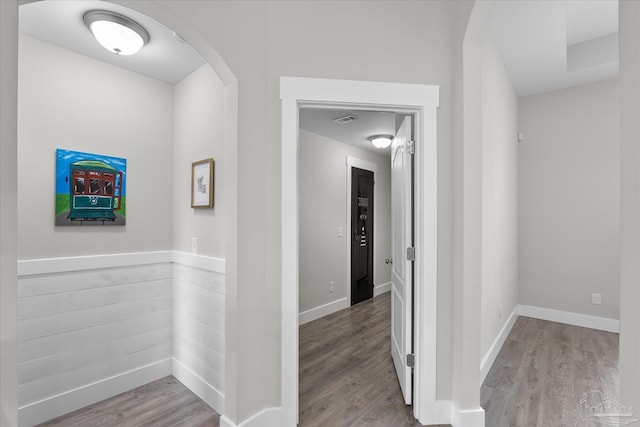 corridor featuring hardwood / wood-style floors