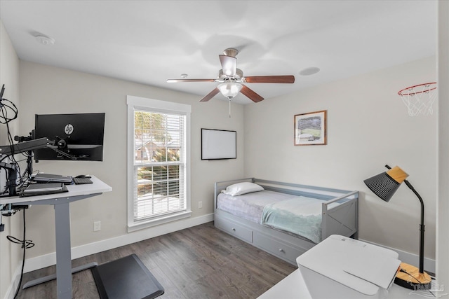 bedroom featuring ceiling fan and dark hardwood / wood-style floors