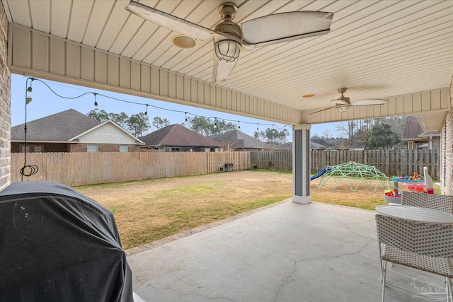 view of patio with grilling area and ceiling fan