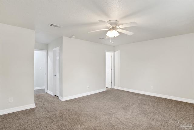 unfurnished room featuring carpet, a textured ceiling, and ceiling fan