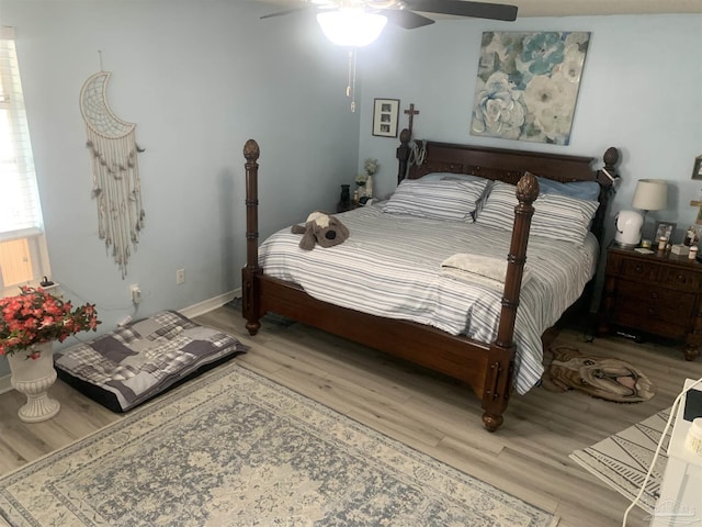 bedroom featuring a ceiling fan and wood finished floors