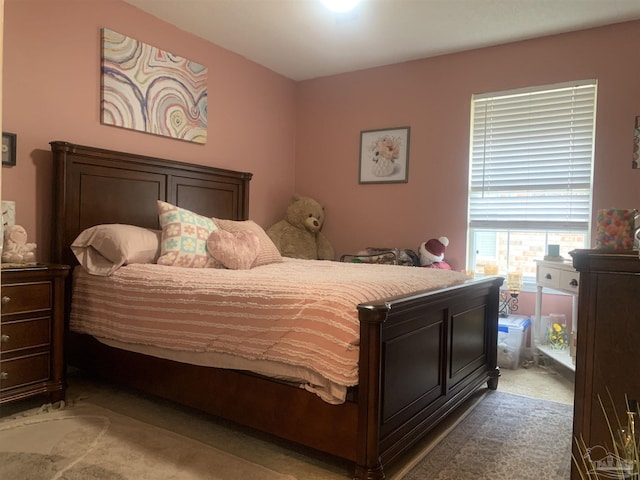 bedroom with light carpet