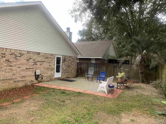 view of yard featuring a patio and fence