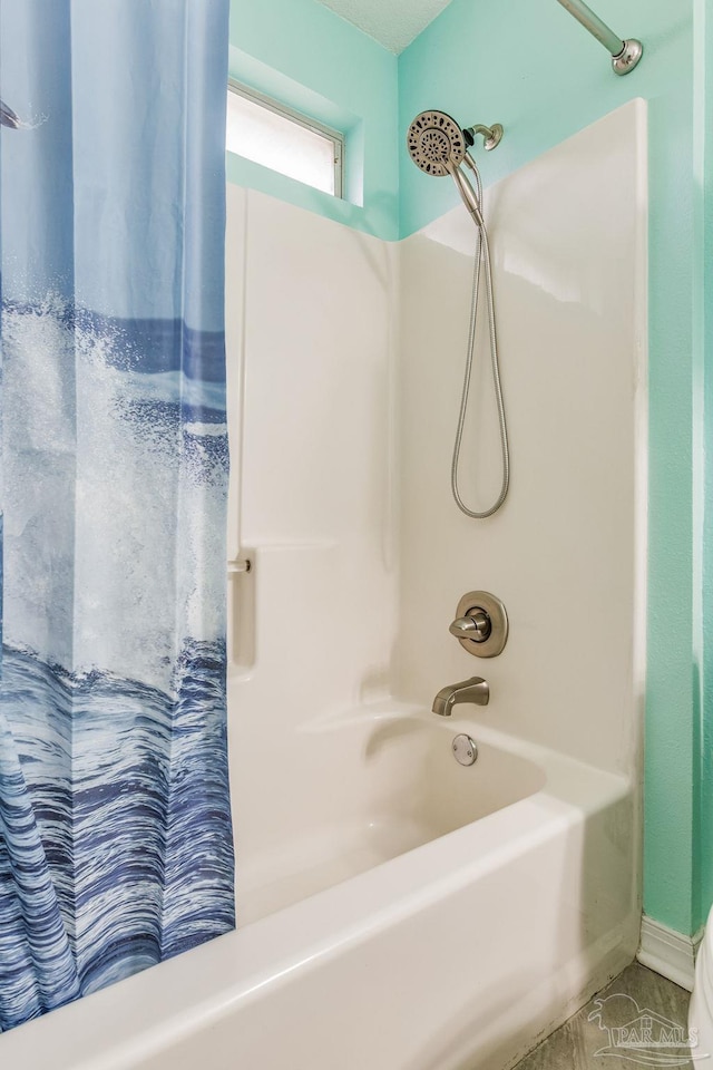 bathroom with shower / bath combo