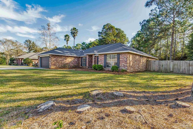 ranch-style home featuring a front yard and a garage