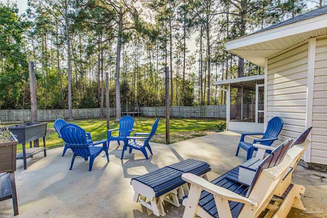 view of patio featuring a sunroom