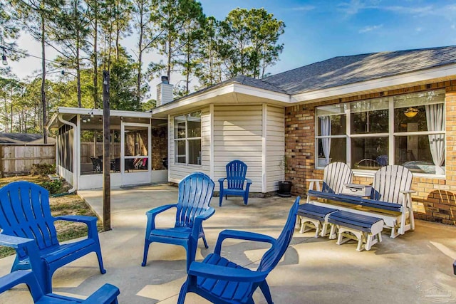 view of patio / terrace featuring a sunroom