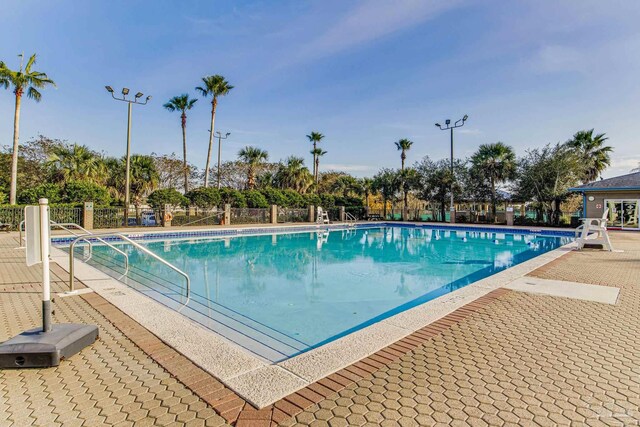 view of swimming pool with a patio