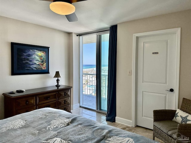 bedroom with access to exterior, floor to ceiling windows, light tile patterned floors, a ceiling fan, and baseboards