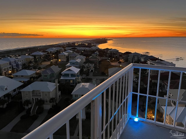 balcony featuring a water view and a residential view