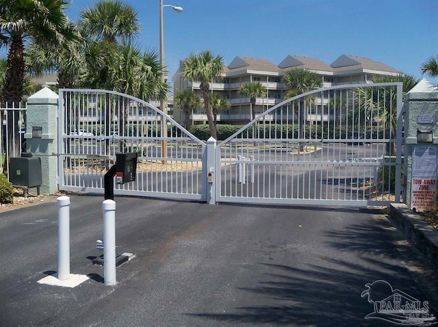 view of gate featuring a residential view