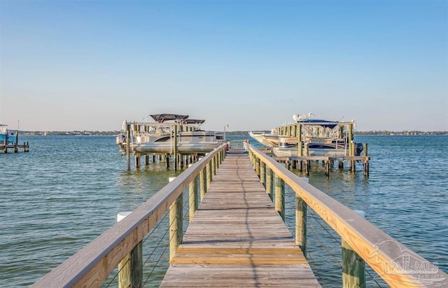 view of dock featuring a water view and boat lift