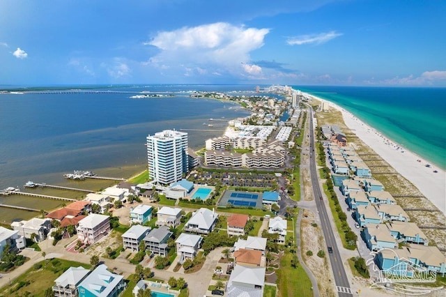 birds eye view of property with a water view and a view of the beach