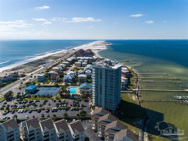 drone / aerial view with a water view and a view of the beach